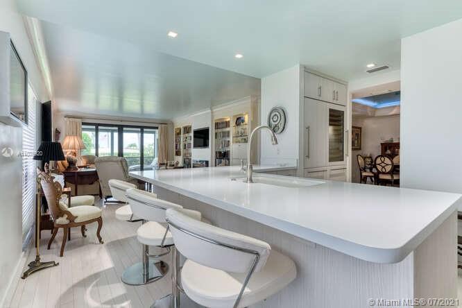 275 South Beach Road, Unit A103 Tequesta, FL 33469 - Photo 10 of 35 a living room with patio furniture and a large window