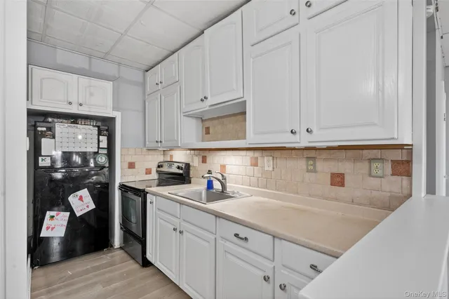 a kitchen with stainless steel appliances granite countertop a sink and cabinets
