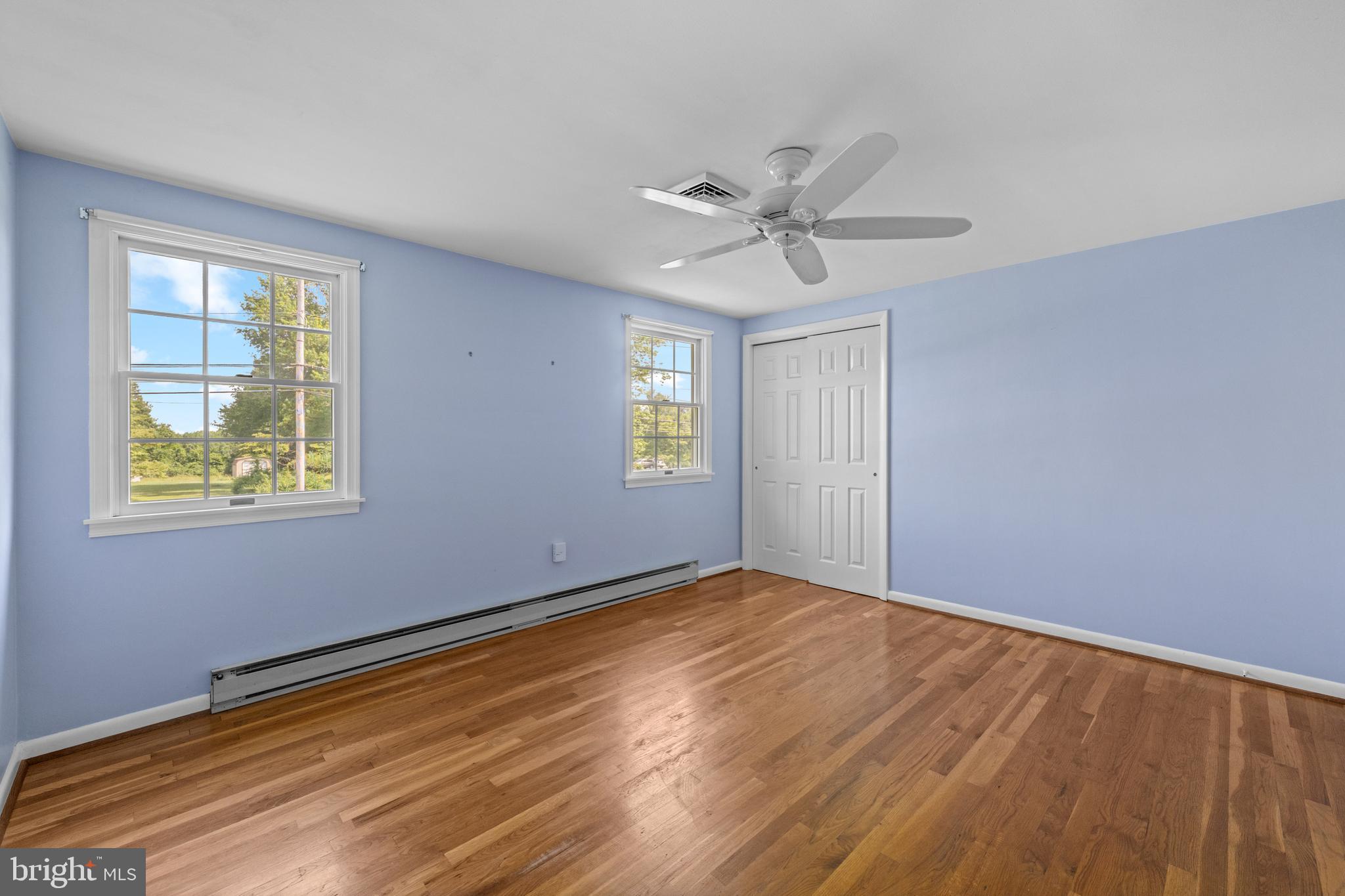 258 Monacy Road Coatesville, PA 19320 - Photo 37 of 54 a view of an empty room with window and wooden floor