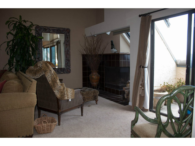 477 Roberts Road Pacifica, CA 94044 - Photo 8 of 25 a living room with furniture and a fireplace