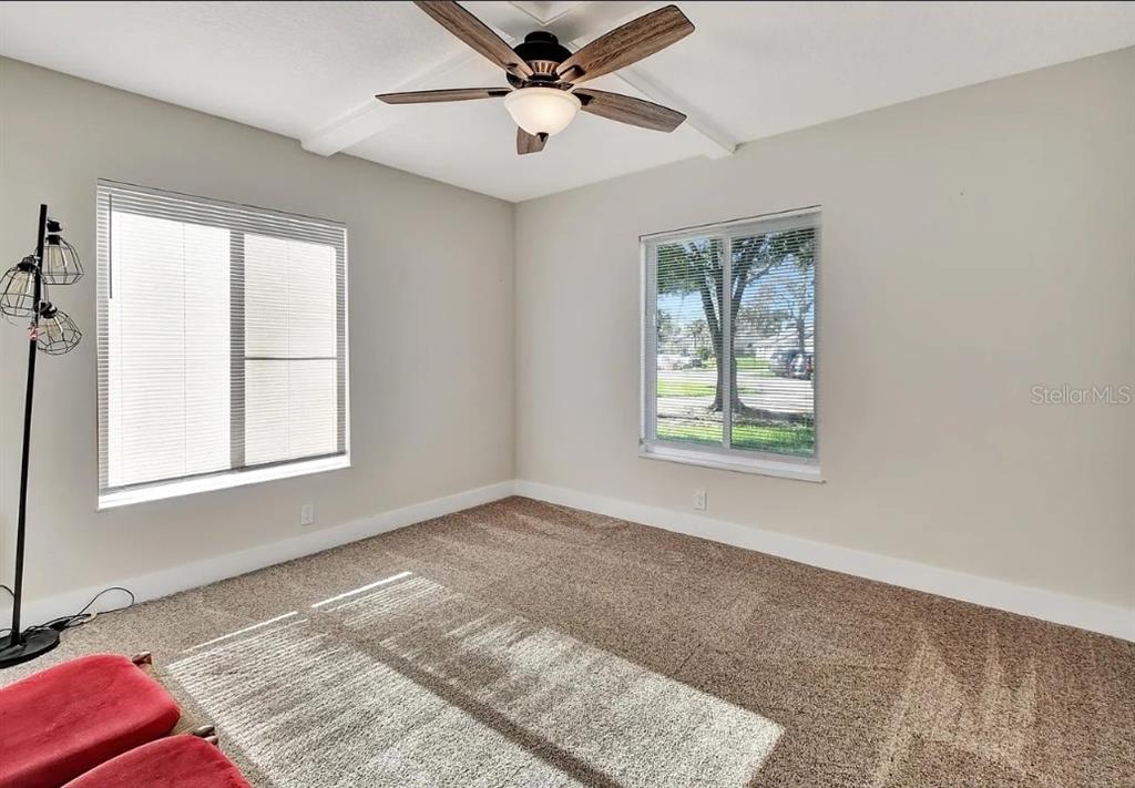102 Bob White Court, Unit 102E Daytona Beach, FL 32119 - Photo 4 of 8 a view of an empty room with a window