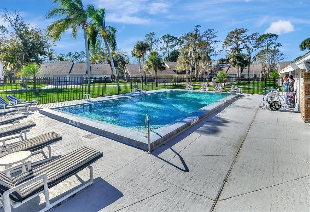 102 Bob White Court, Unit 102E Daytona Beach, FL 32119 - Photo 6 of 8 front view of a house with a yard