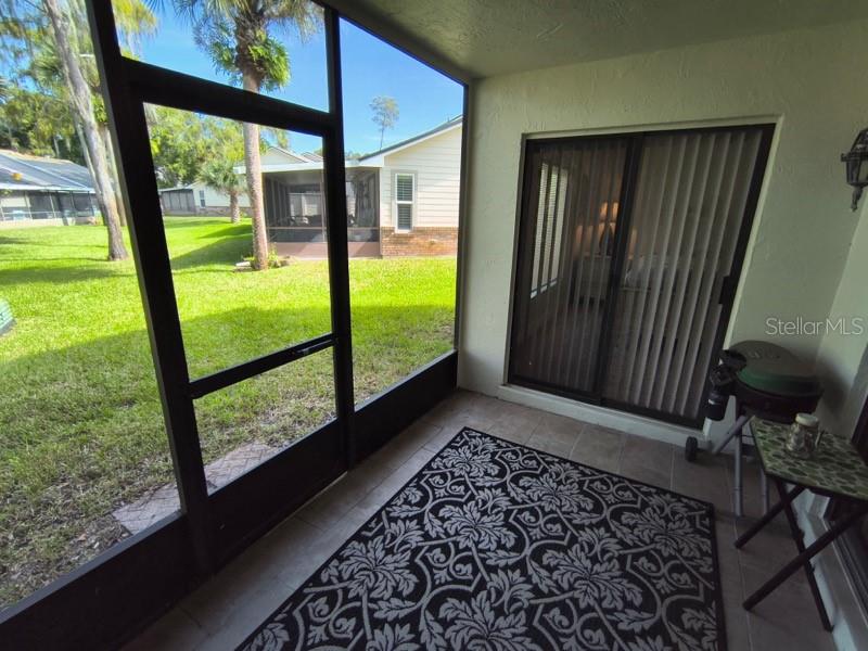 102 Bob White Court, Unit 102E Daytona Beach, FL 32119 - Photo 8 of 8 a view of back yard from a window