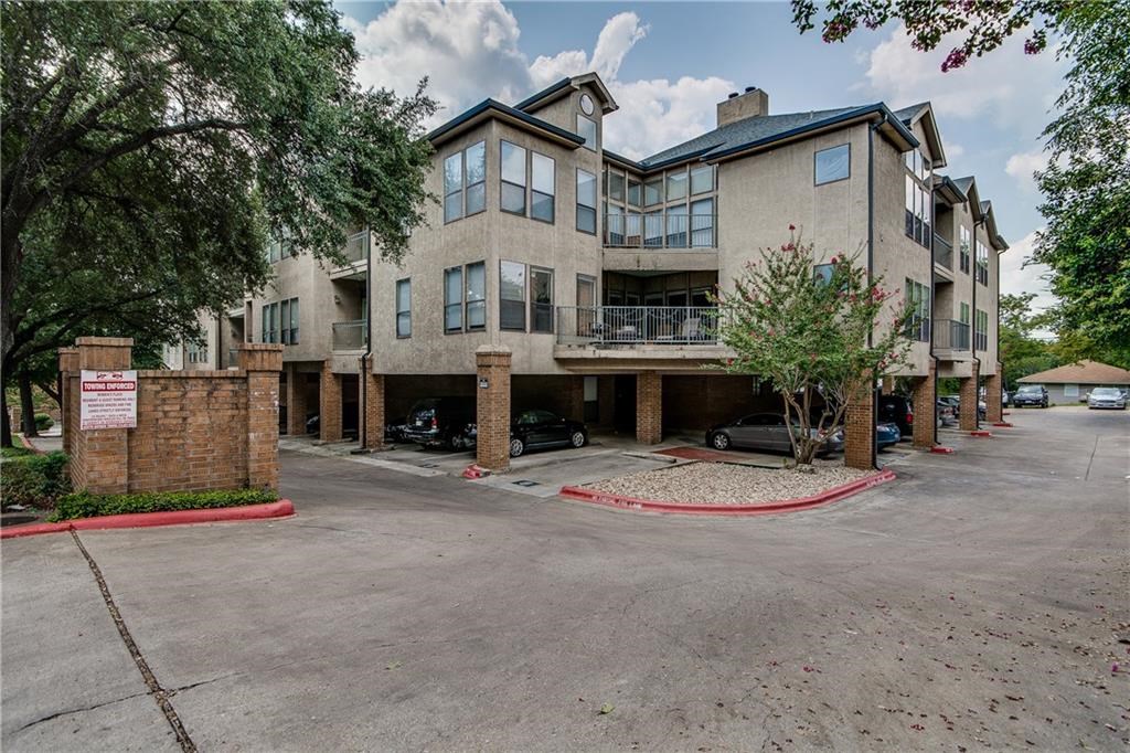 1906 Robbins Place, Unit 308 Austin, TX 78705 - Photo 2 of 4 a front view of a house with a yard and garage