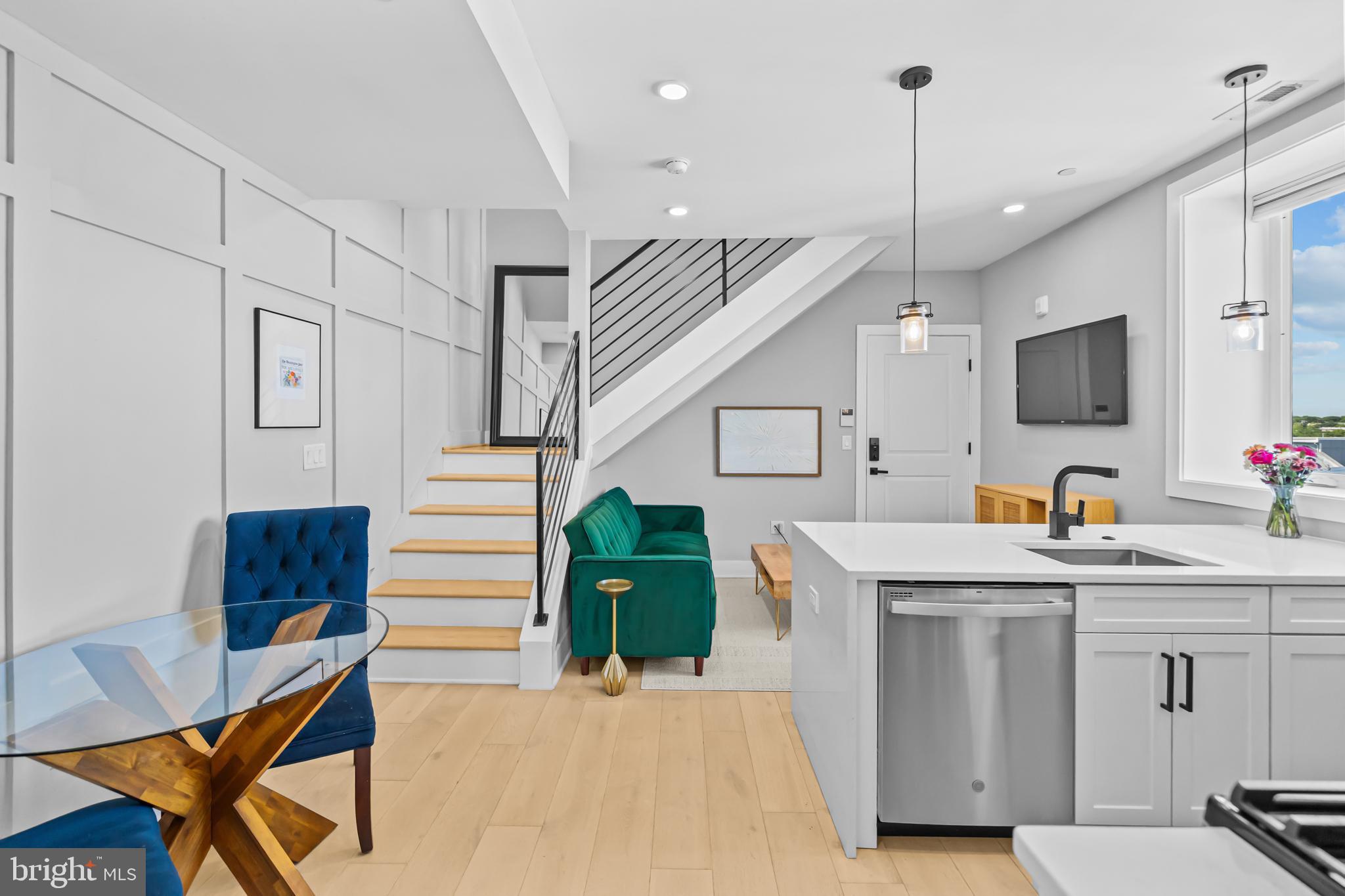 1915 H Street Northeast, Unit PH1 Washington, DC 20002 - Photo 1 of 21 a kitchen with cabinets and chairs
