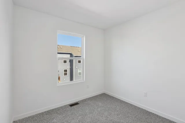 a view of a small space with window in a room