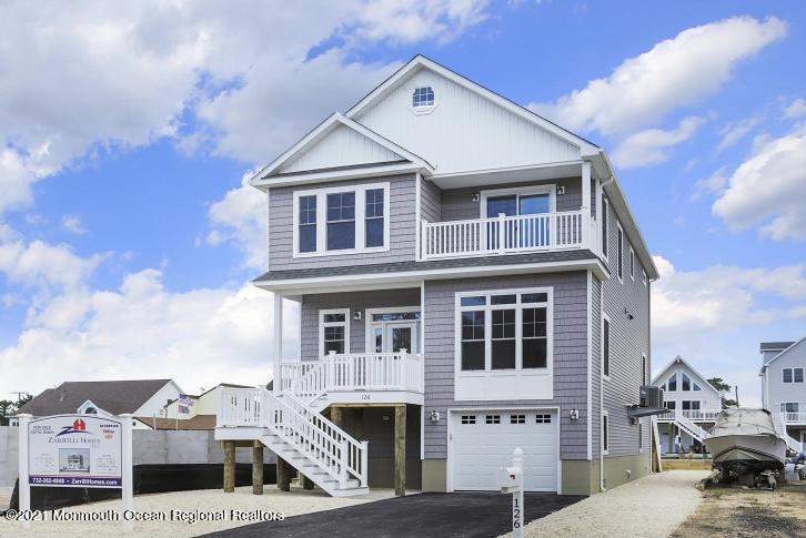 36 Channel Road Toms River, NJ 08753 - Photo 1 of 10 a front view of a house with a yard