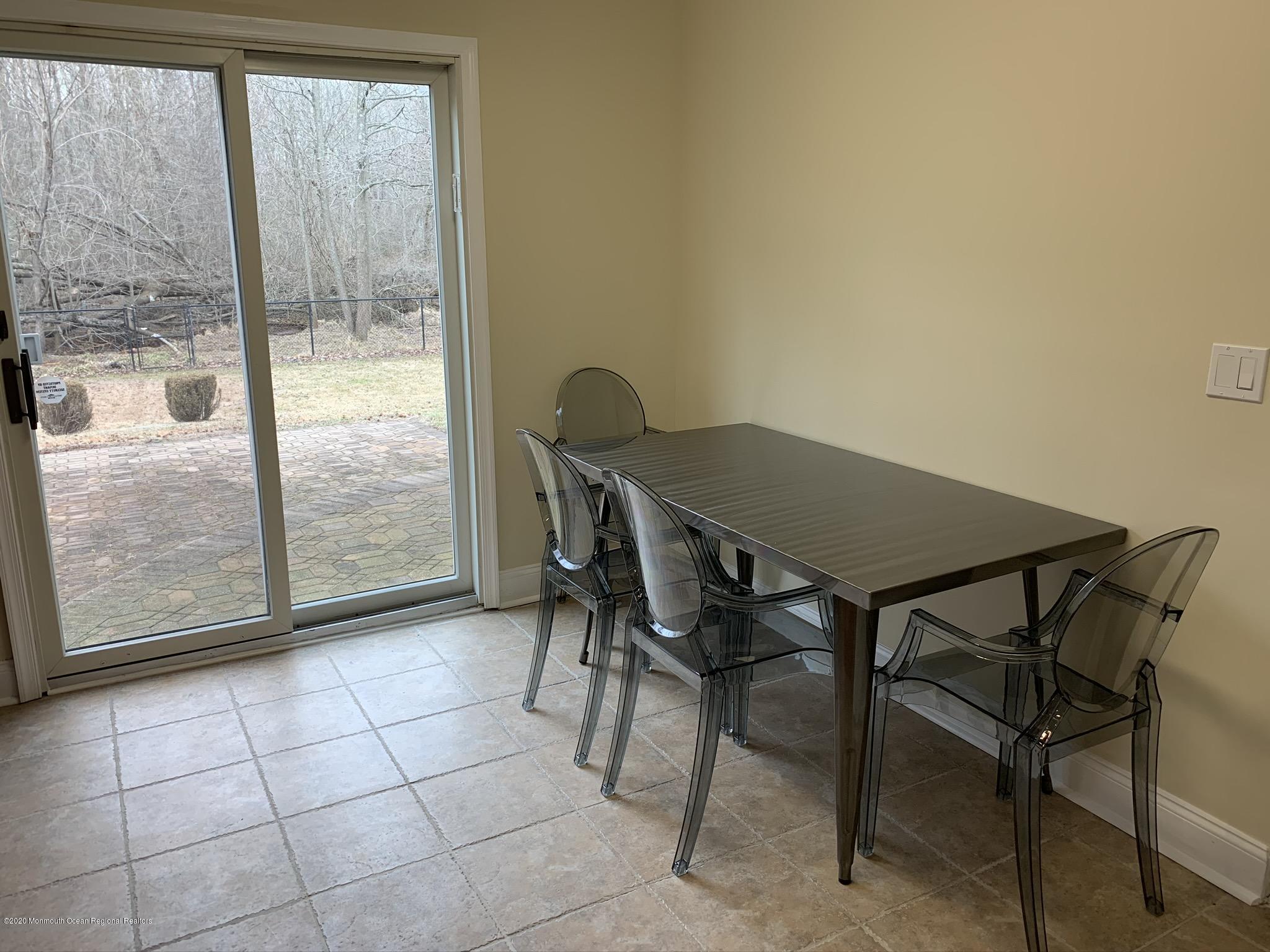 33 Heath Avenue Oakhurst, NJ 07755 - Photo 16 of 48 a view of a dining room with furniture and a window
