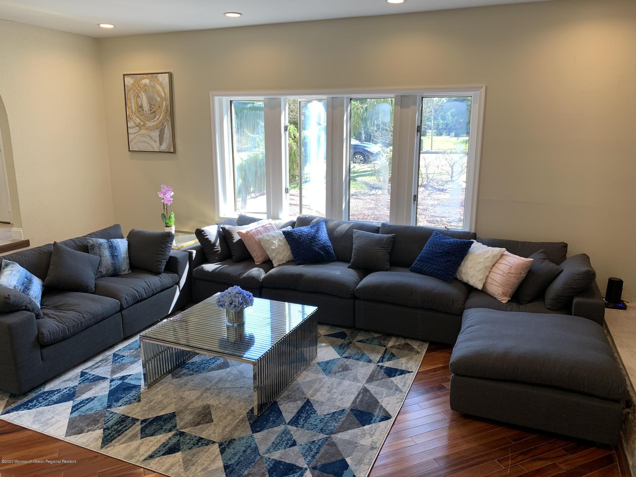 33 Heath Avenue Oakhurst, NJ 07755 - Photo 18 of 48 a living room with furniture window and wooden floor