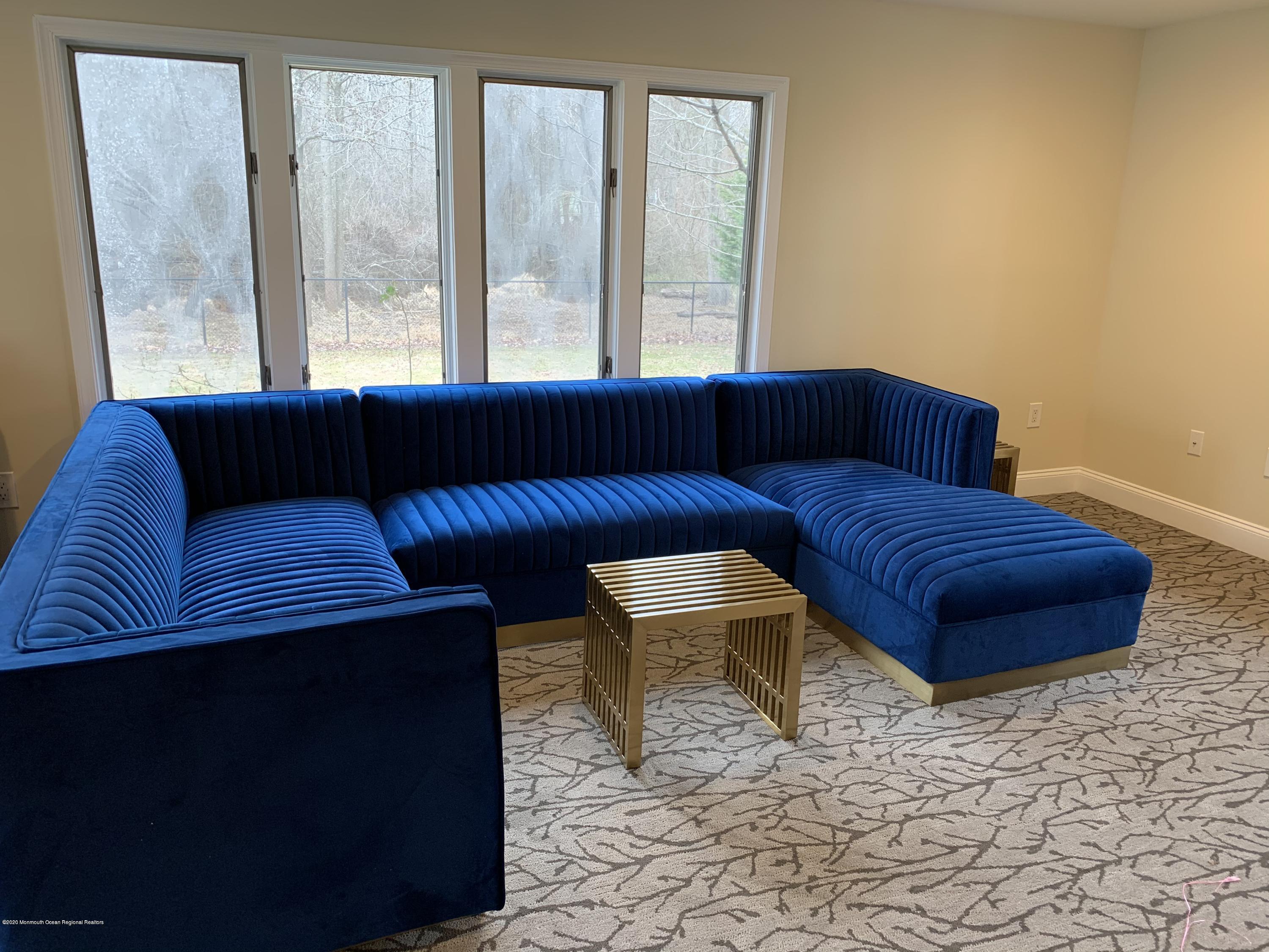 33 Heath Avenue Oakhurst, NJ 07755 - Photo 22 of 48 a living room with furniture and large windows