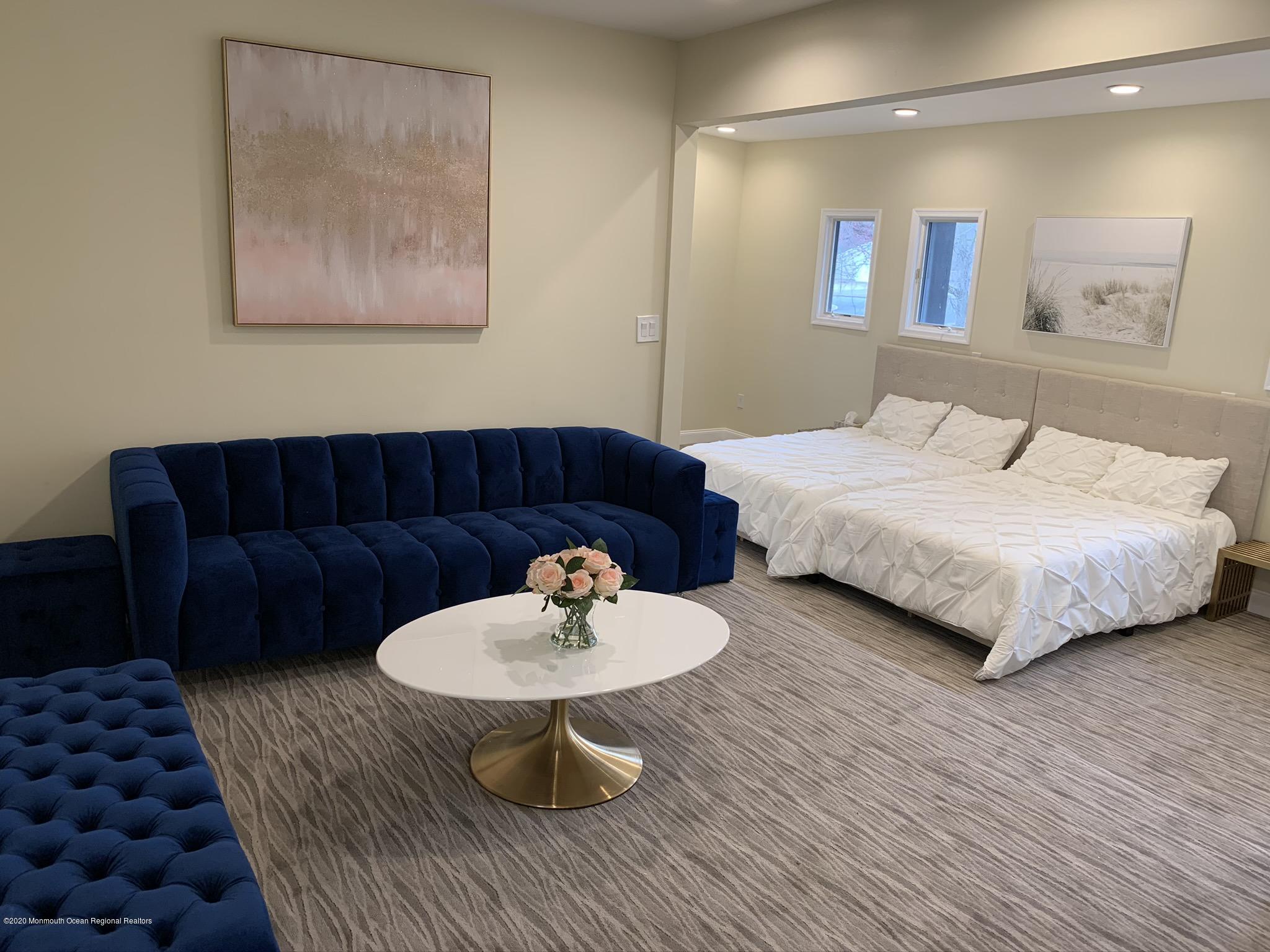 33 Heath Avenue Oakhurst, NJ 07755 - Photo 25 of 48 a bedroom with a bed and a couch