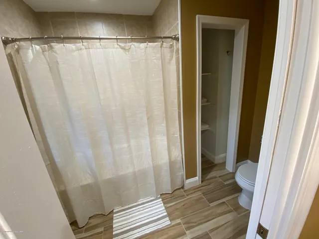 a bedroom with two beds and painted walls