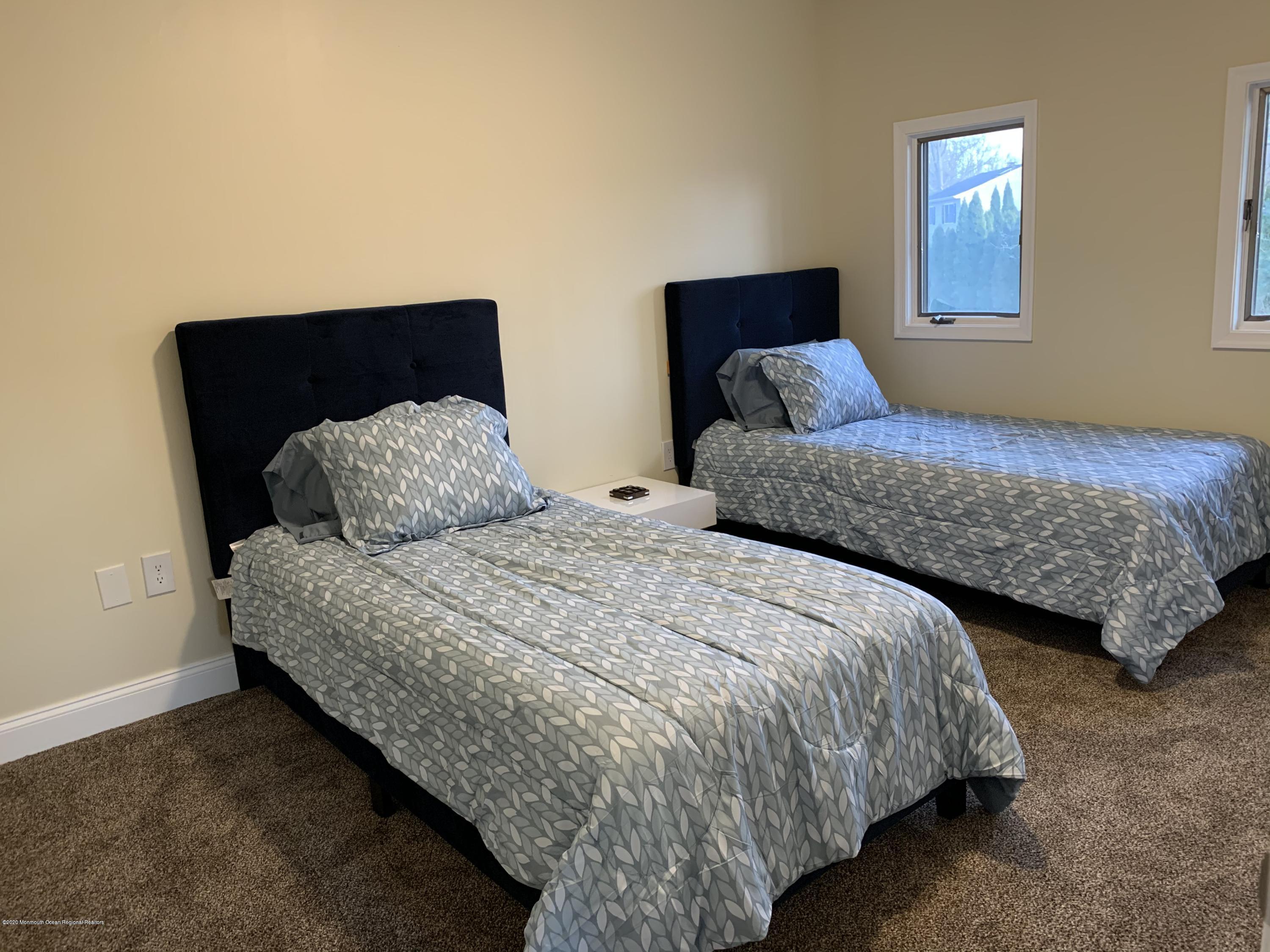 33 Heath Avenue Oakhurst, NJ 07755 - Photo 38 of 48 a bedroom with bed and window