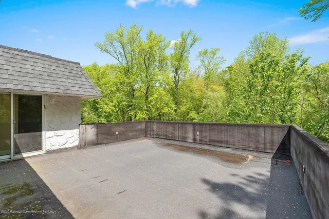 a view of a backyard with large trees
