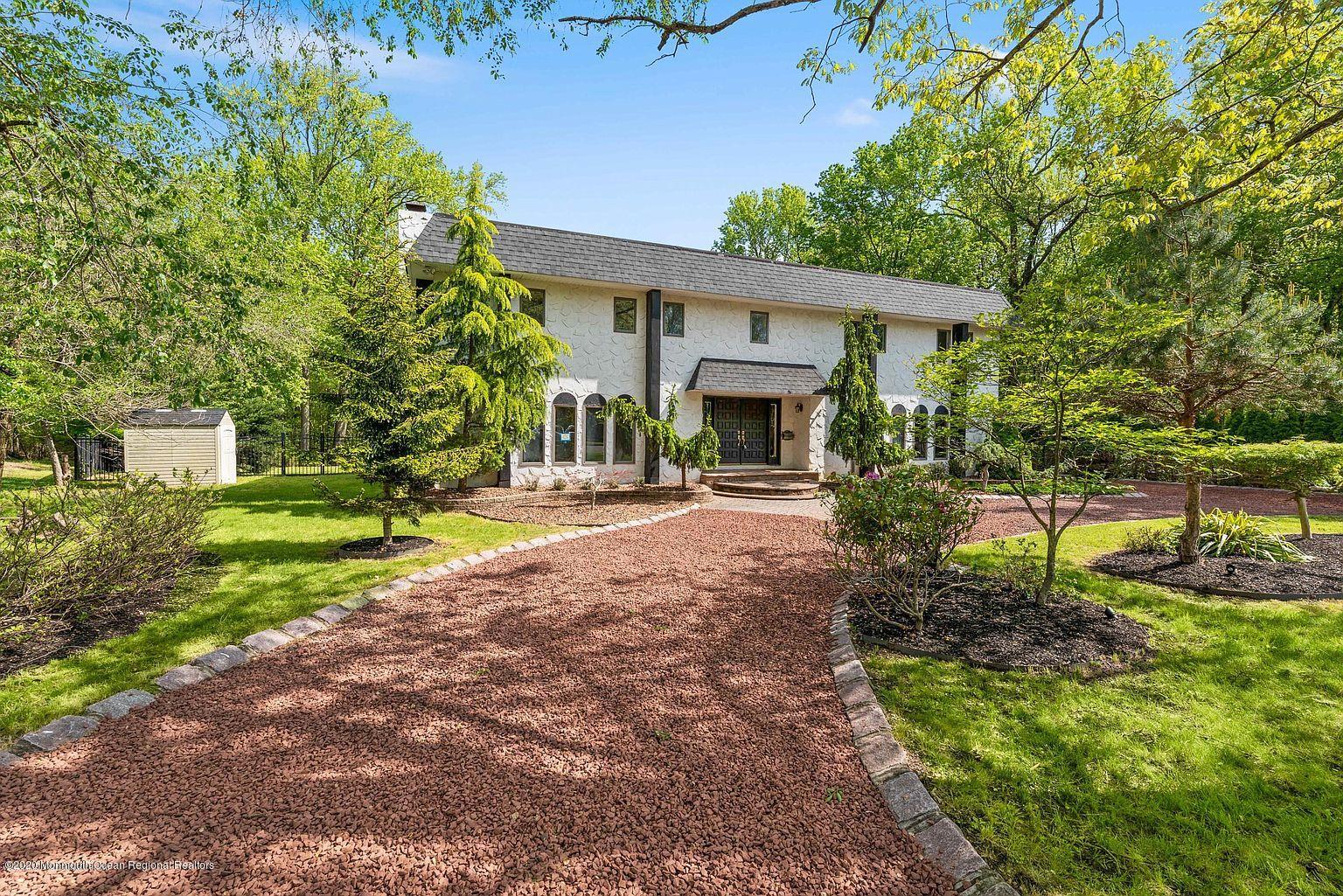 33 Heath Avenue Oakhurst, NJ 07755 - Photo 4 of 48 a front view of a house with garden