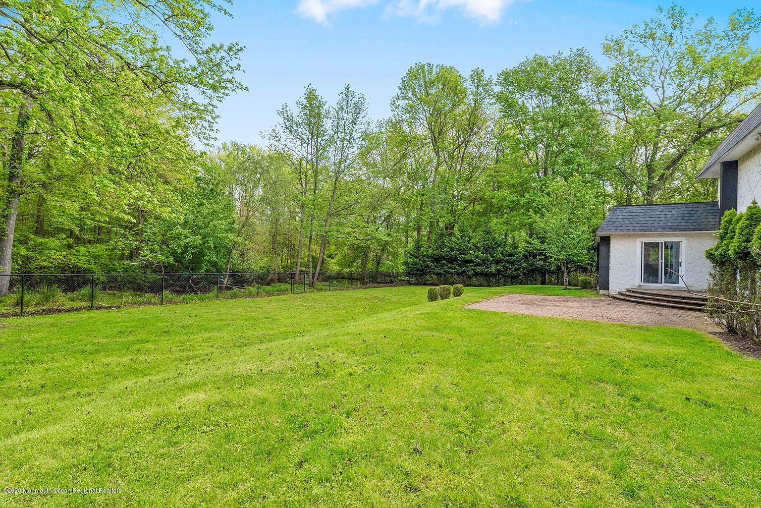 33 Heath Avenue Oakhurst, NJ 07755 - Photo 41 of 48 front view of a house with a garden