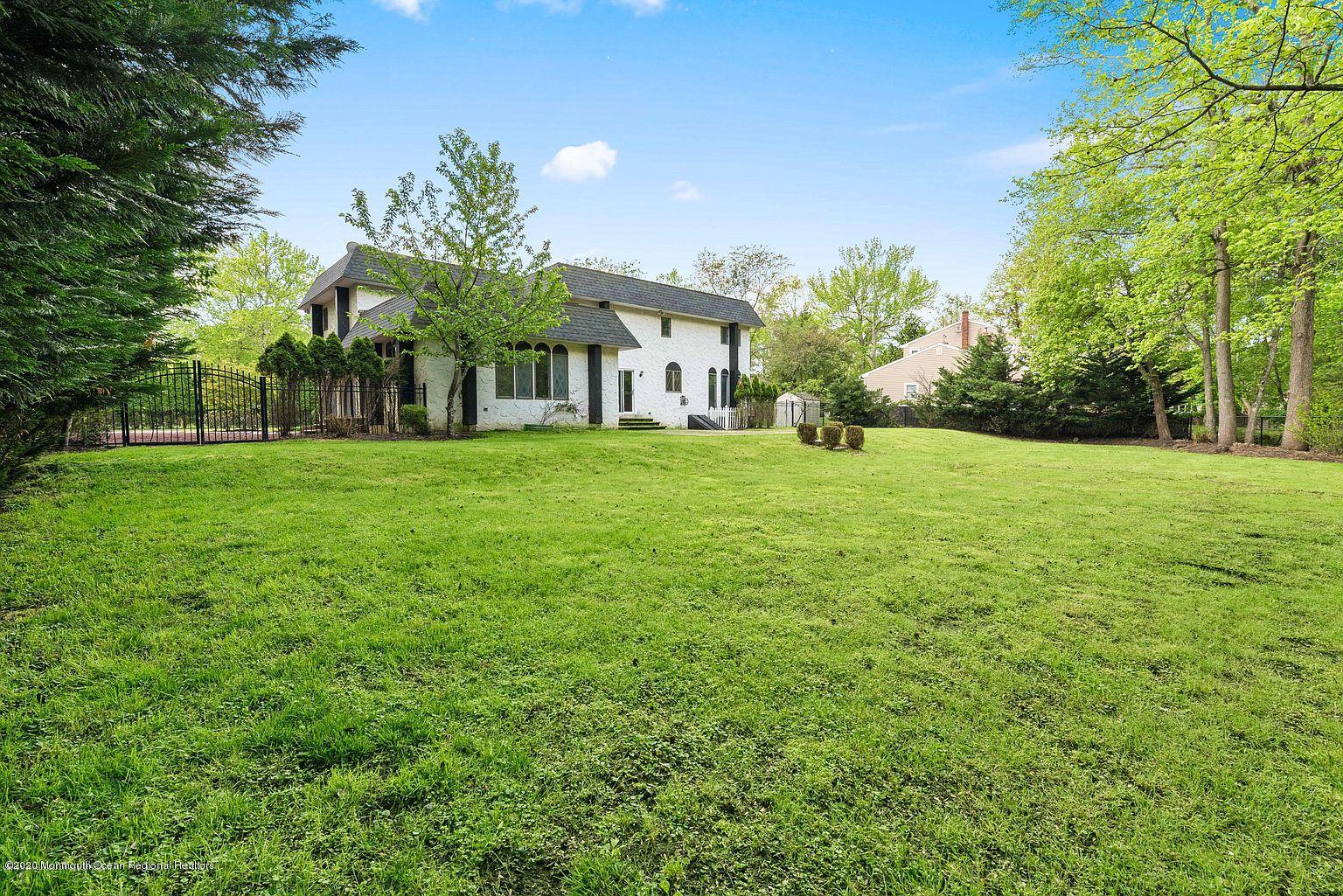 33 Heath Avenue Oakhurst, NJ 07755 - Photo 45 of 48 a front view of house with yard and trees