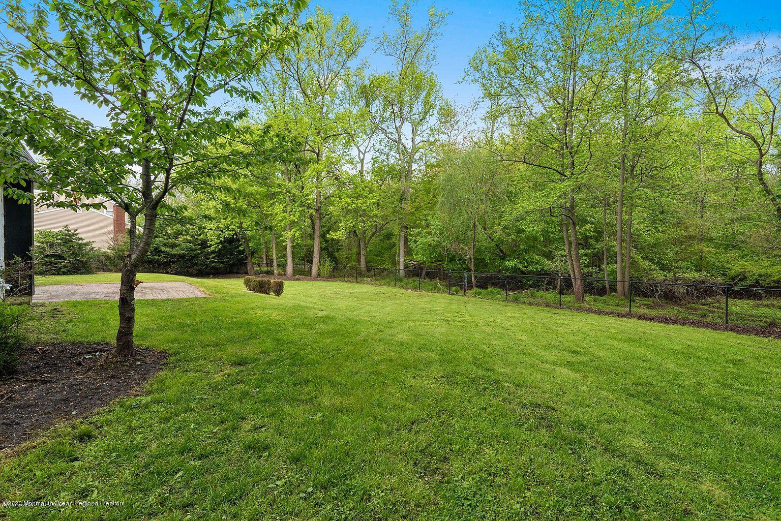 33 Heath Avenue Oakhurst, NJ 07755 - Photo 46 of 48 a view of green field with trees in the background