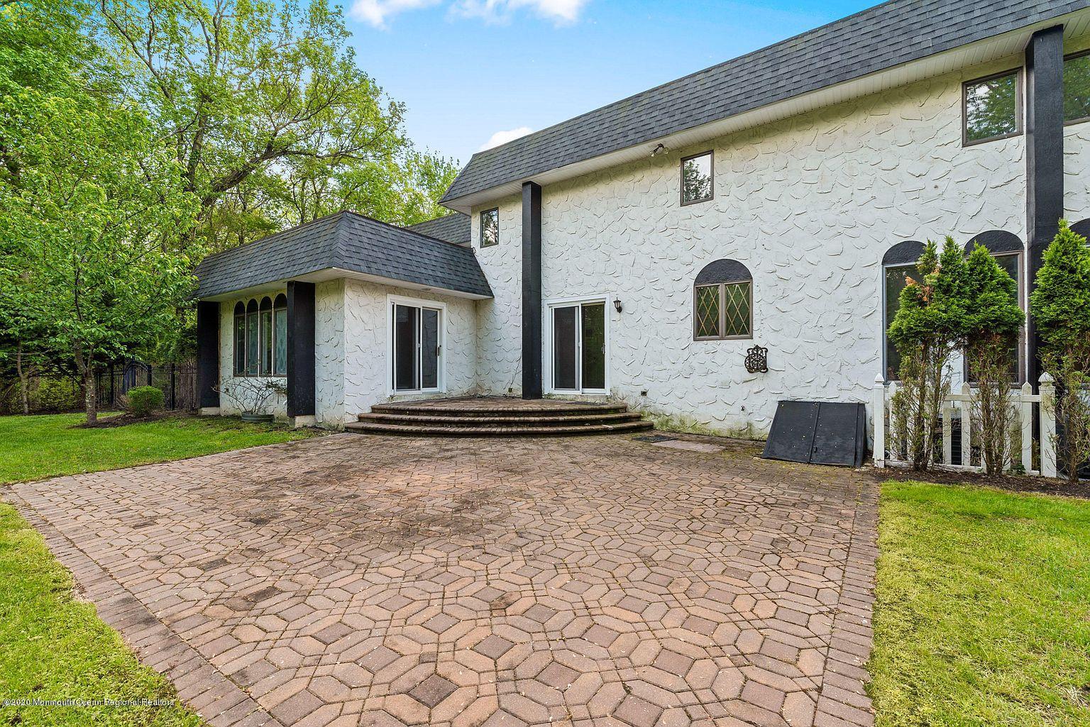 33 Heath Avenue Oakhurst, NJ 07755 - Photo 47 of 48 a front view of a house with garden