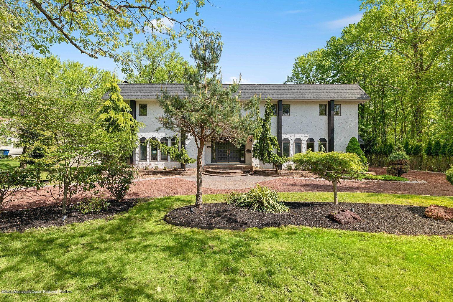 33 Heath Avenue Oakhurst, NJ 07755 - Photo 5 of 48 a house view with a garden space
