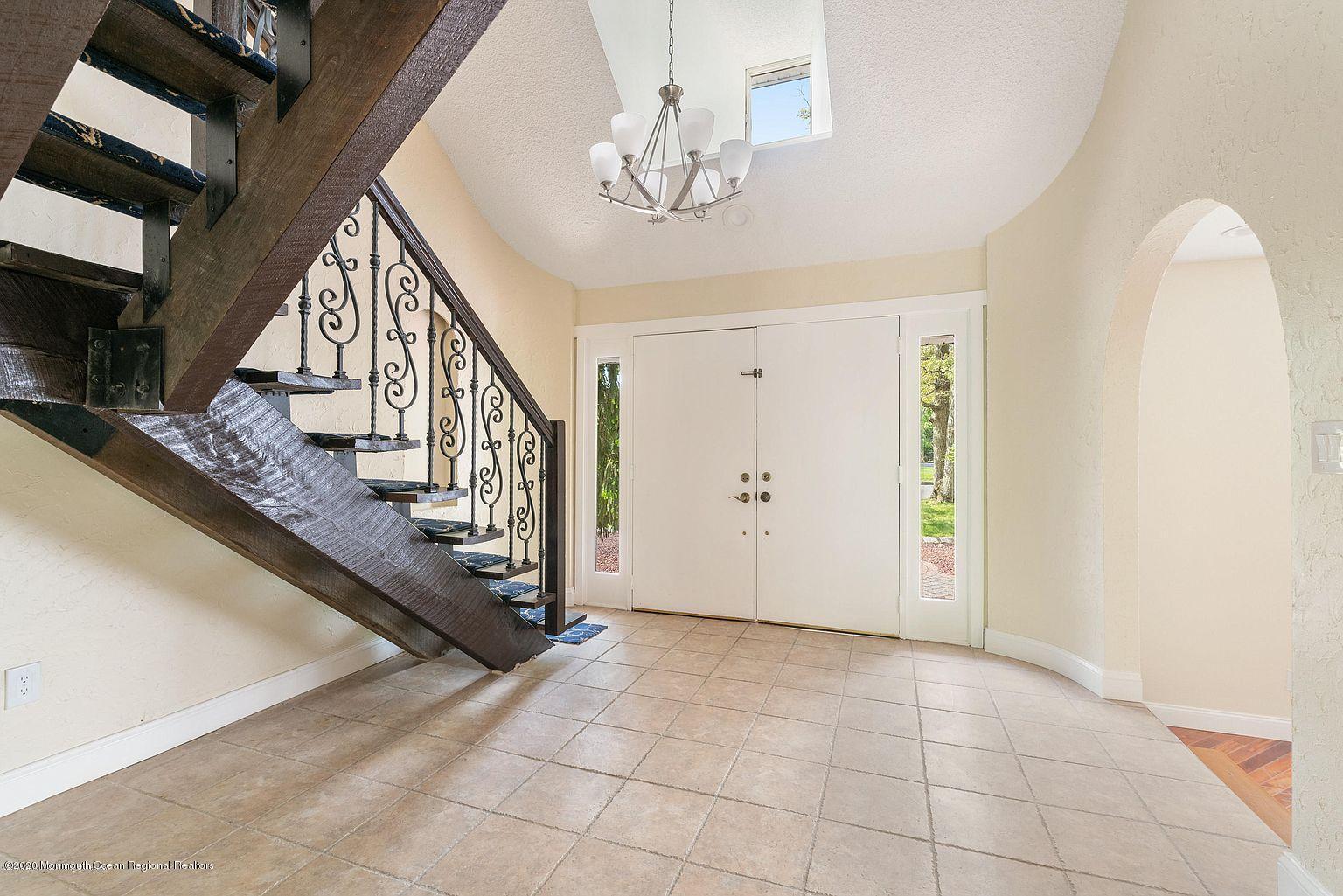 33 Heath Avenue Oakhurst, NJ 07755 - Photo 8 of 48 a view of an entryway with staircase