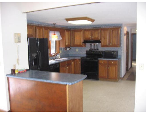 292 Mulpus Road Lunenburg, MA 01462 - Photo 3 of 18 a kitchen with stainless steel appliances granite countertop a stove a refrigerator and a kitchen island