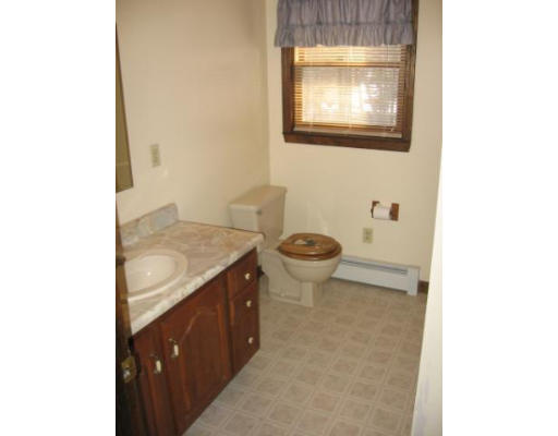 292 Mulpus Road Lunenburg, MA 01462 - Photo 5 of 18 a bathroom with a sink and a mirror