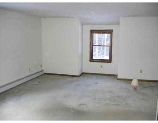 292 Mulpus Road Lunenburg, MA 01462 - Photo 7 of 18 an empty room with a window