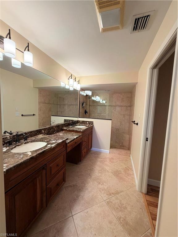 1941 Princess Court Naples, FL 34110 - Photo 11 of 17 a large kitchen with a stove and a sink