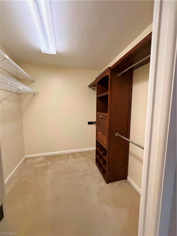 1941 Princess Court Naples, FL 34110 - Photo 12 of 17 a view of an empty walk in closet