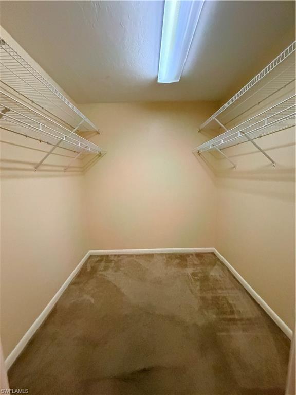 1941 Princess Court Naples, FL 34110 - Photo 13 of 17 a view of a room with racks on the wall