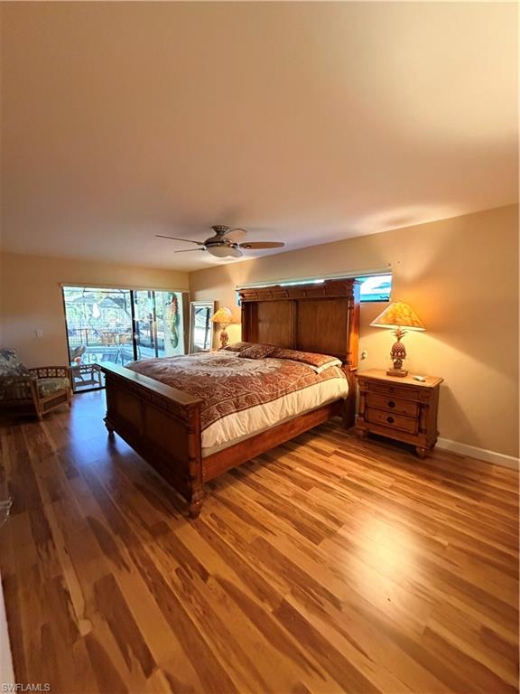 1941 Princess Court Naples, FL 34110 - Photo 14 of 17 a living room with furniture and a wooden floor