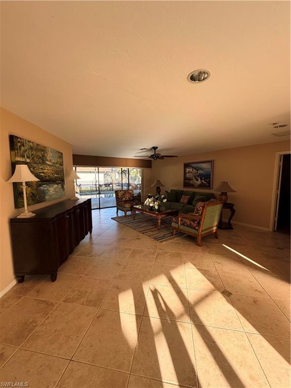 1941 Princess Court Naples, FL 34110 - Photo 15 of 17 a living room with furniture and a flat screen tv