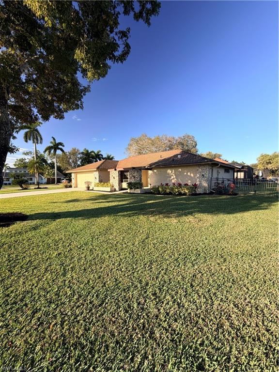 1941 Princess Court Naples, FL 34110 - Photo 17 of 17 a view of a lake with houses