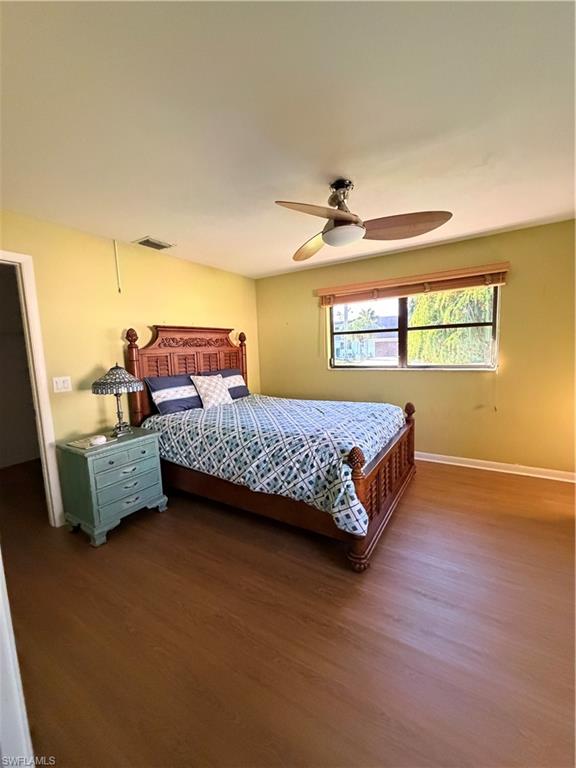 1941 Princess Court Naples, FL 34110 - Photo 5 of 17 a bedroom with a bed and a couch