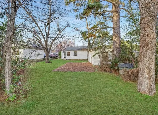 a view of a yard with a tree