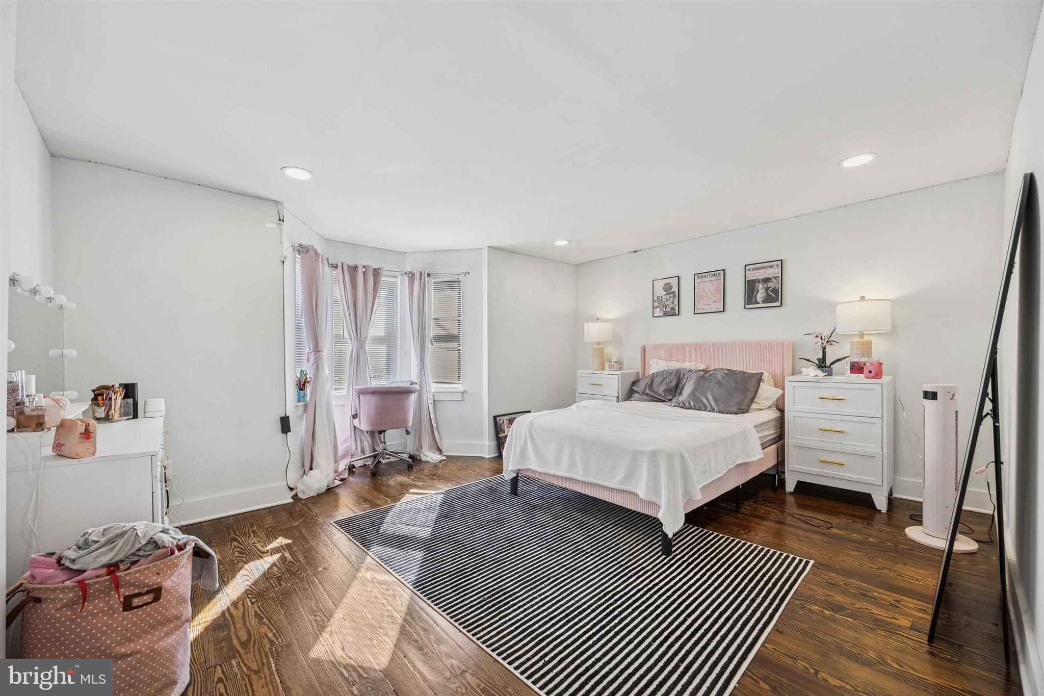 14 Maple Street Conshohocken, PA 19428 - Photo 11 of 27 a bedroom with a bed and wooden floor