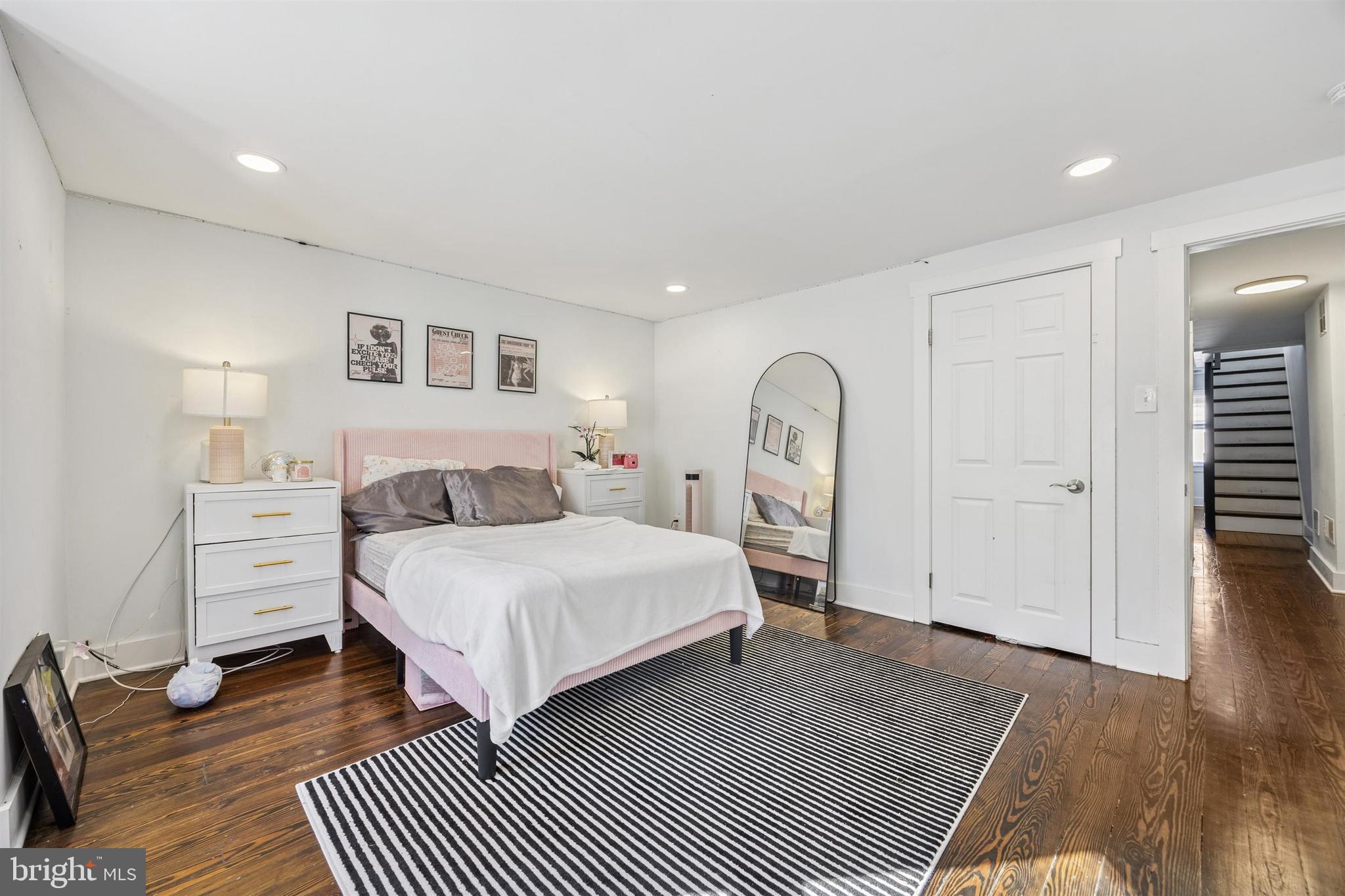 14 Maple Street Conshohocken, PA 19428 - Photo 12 of 27 a spacious bedroom with a bed and wooden floor