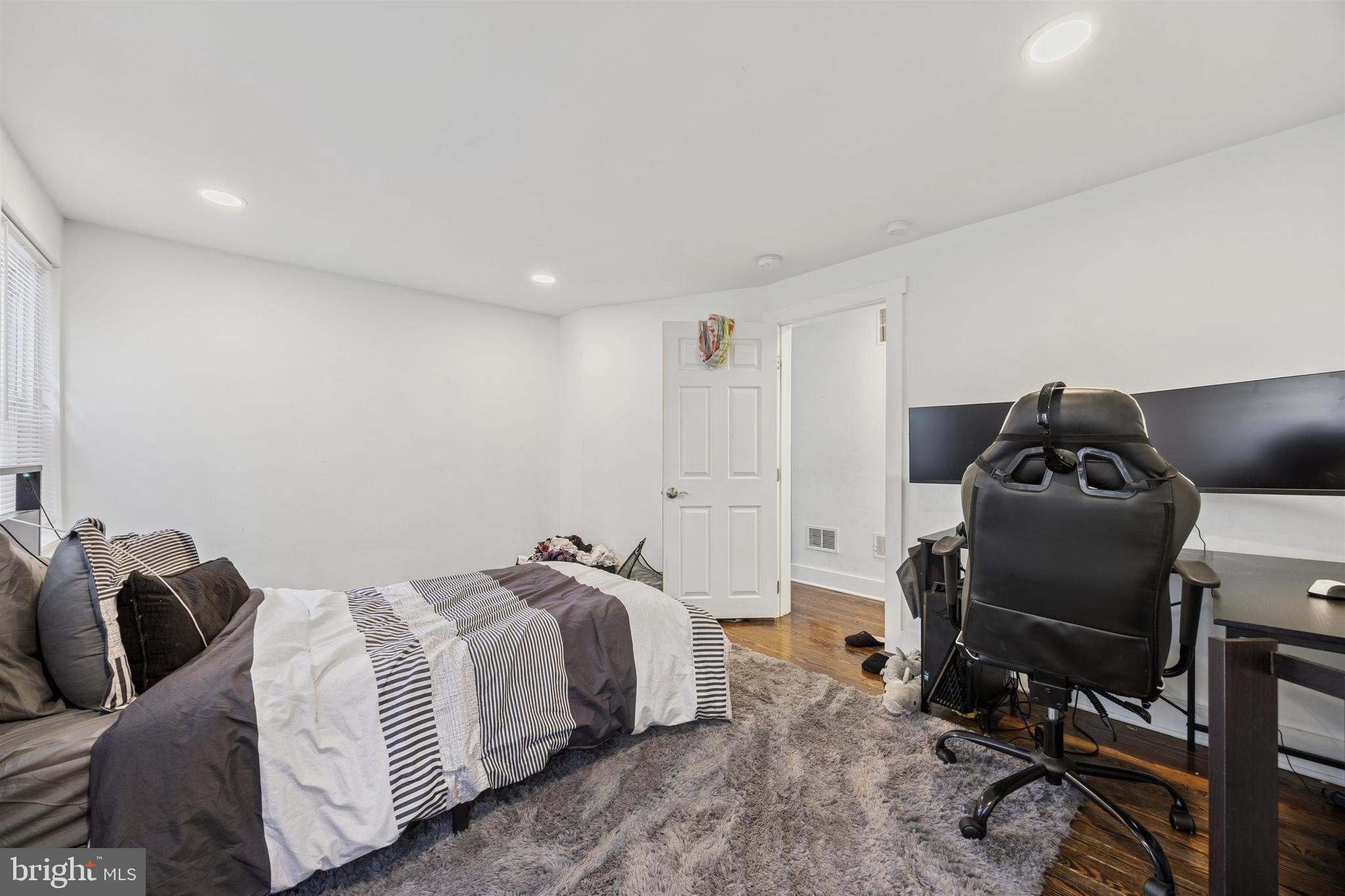 14 Maple Street Conshohocken, PA 19428 - Photo 13 of 27 a bedroom with a bed and a desk