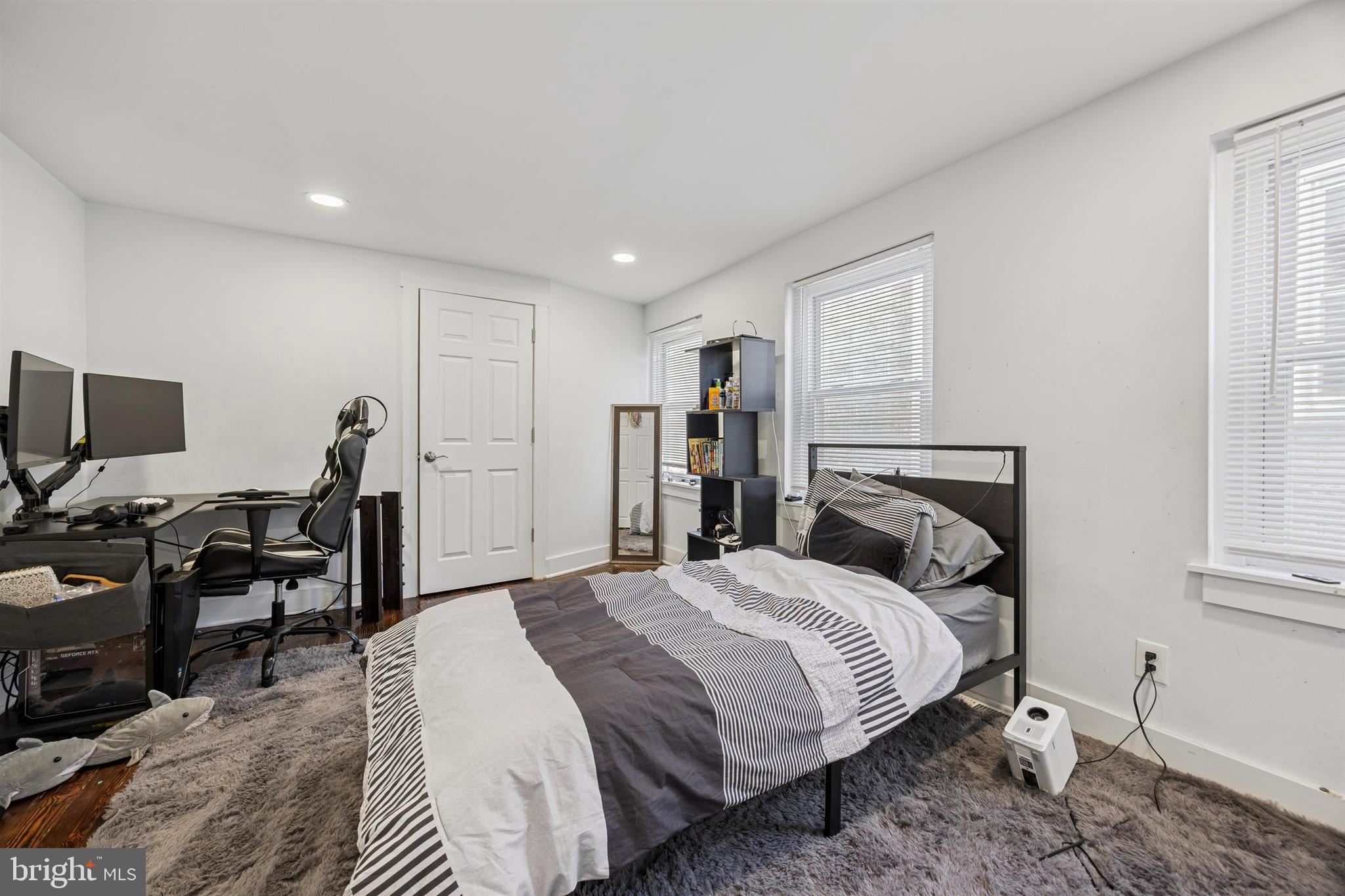 14 Maple Street Conshohocken, PA 19428 - Photo 14 of 27 a bed room with a bed and a chair