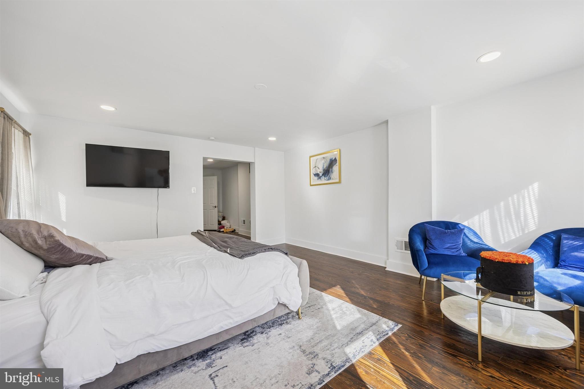 14 Maple Street Conshohocken, PA 19428 - Photo 20 of 27 a bedroom with a bed and glass chair