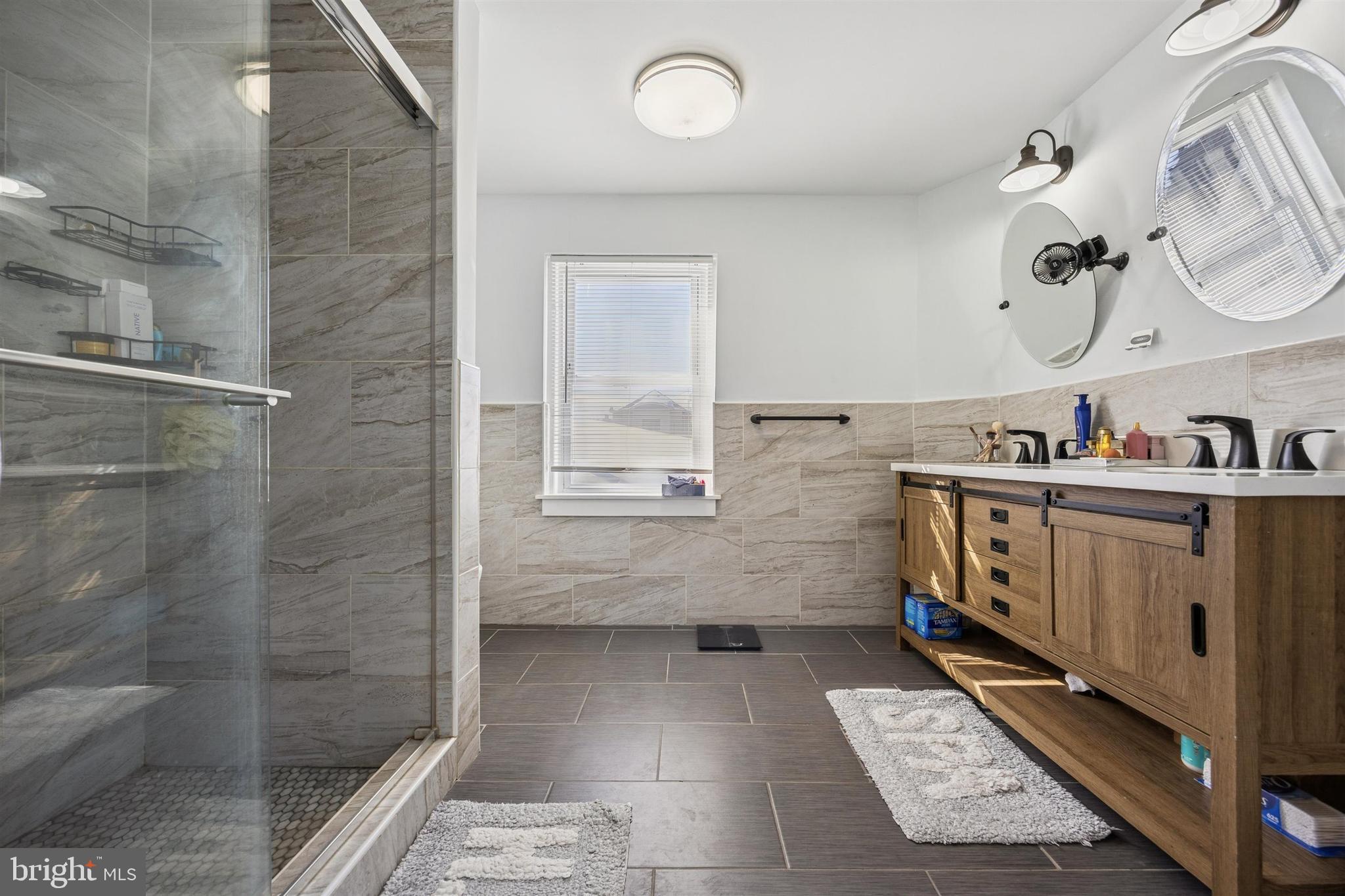 14 Maple Street Conshohocken, PA 19428 - Photo 23 of 27 a bathroom with a sink a mirror and a shower