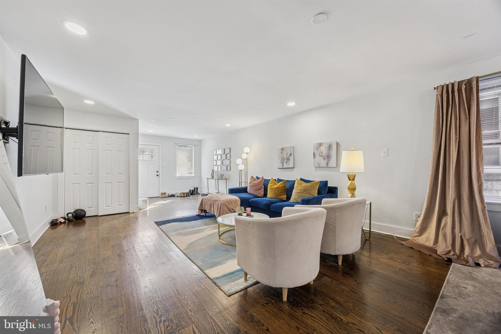 14 Maple Street Conshohocken, PA 19428 - Photo 4 of 27 a living room with dining room and wooden floor