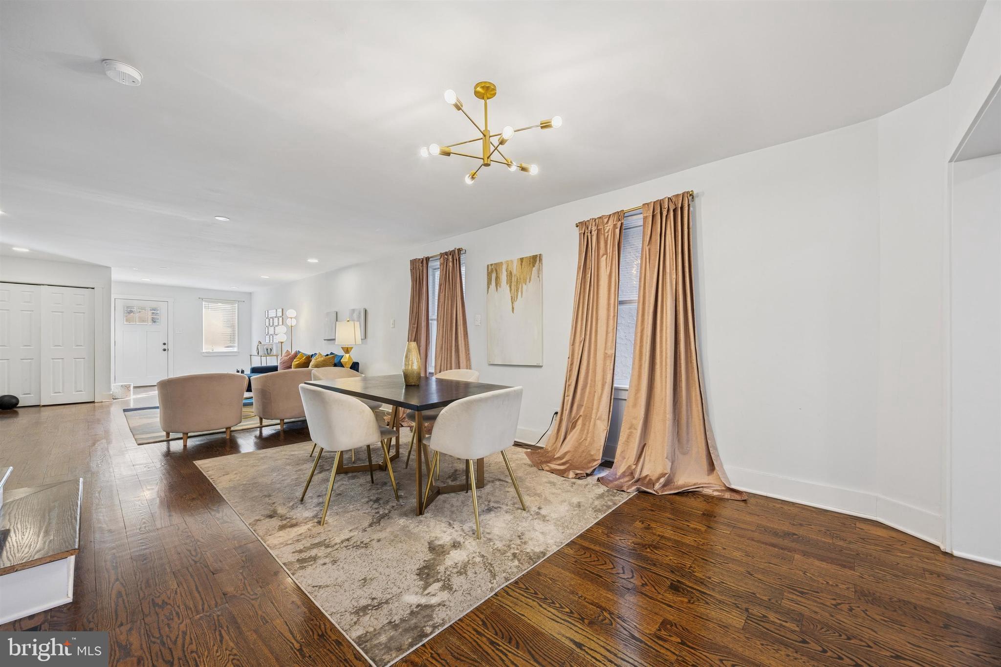 14 Maple Street Conshohocken, PA 19428 - Photo 7 of 27 a living room with a dining table furniture and a window
