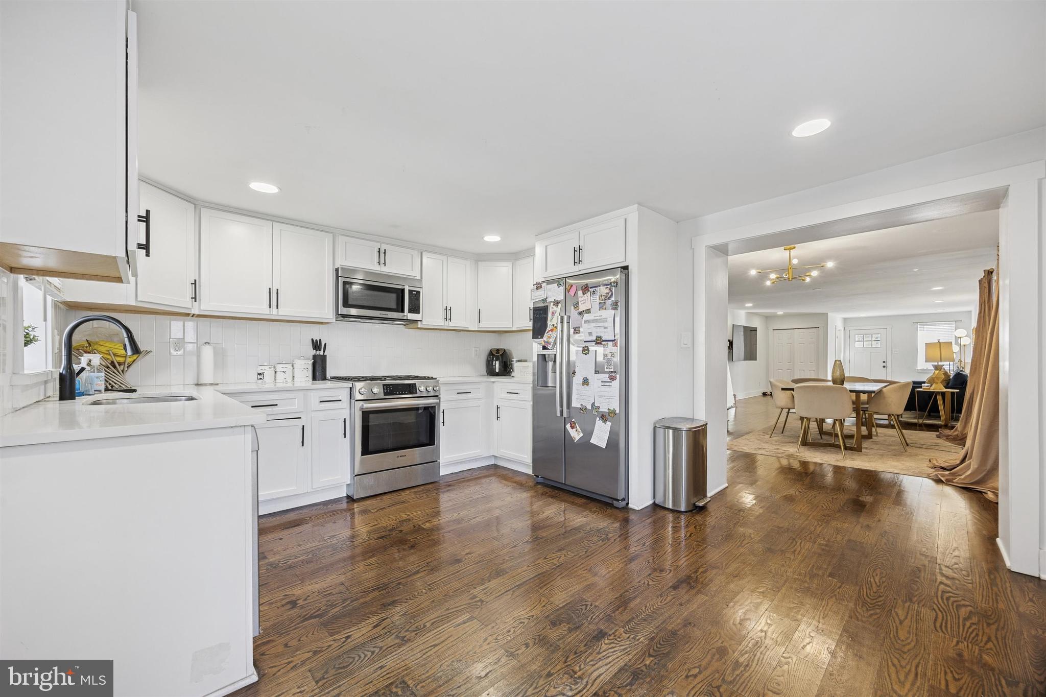 14 Maple Street Conshohocken, PA 19428 - Photo 9 of 27 a kitchen with stainless steel appliances a refrigerator sink and white cabinets