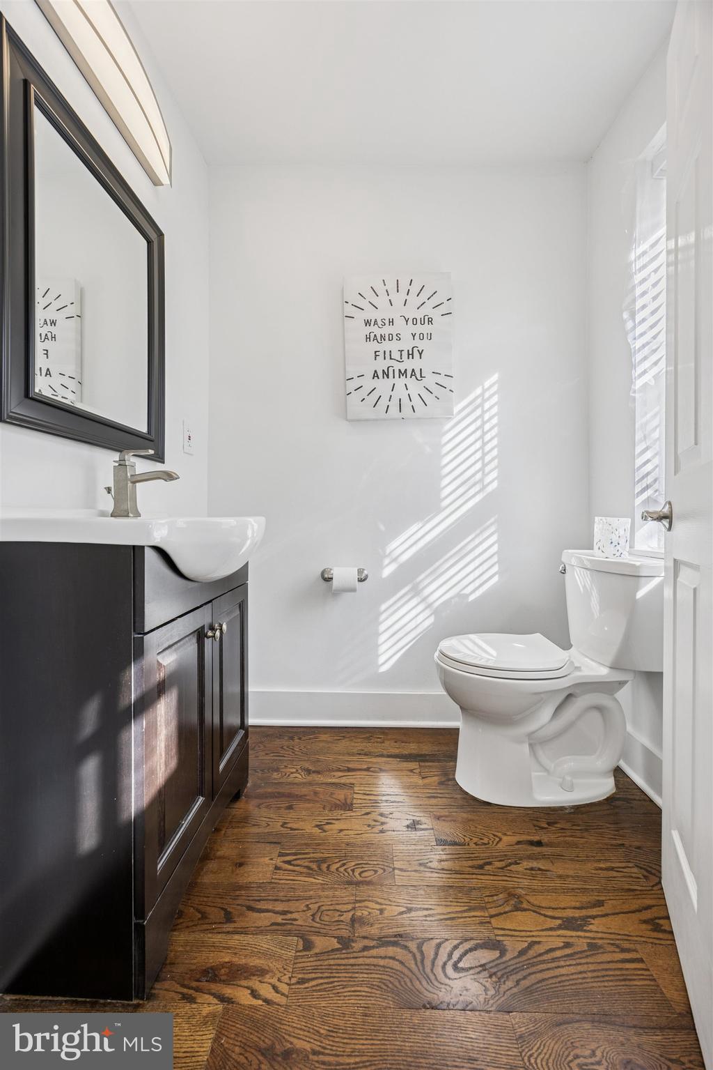 14 Maple Street Conshohocken, PA 19428 - Photo 10 of 27 a bathroom with a toilet a sink and mirror