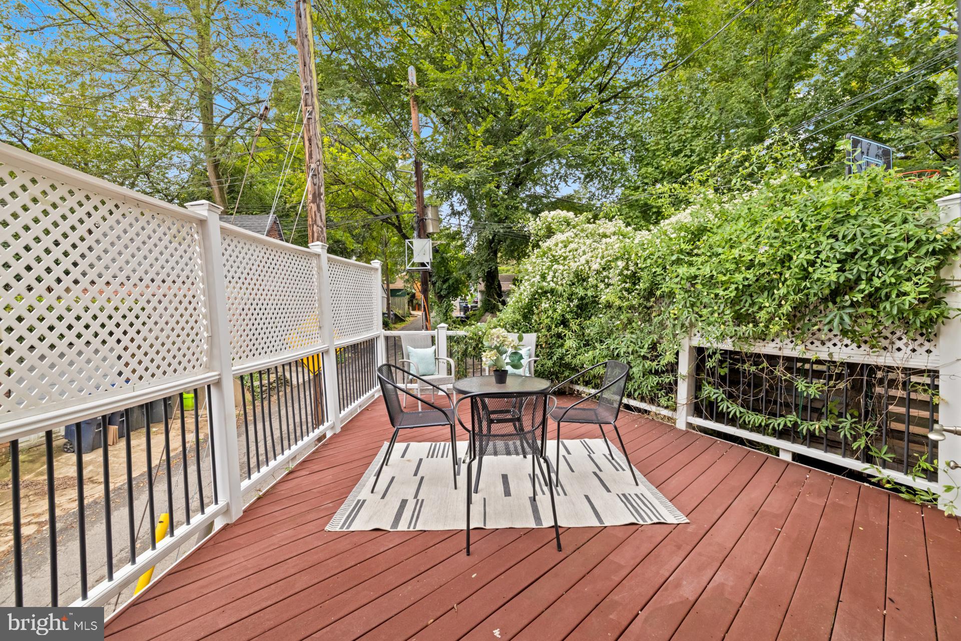 1628 44th Street Northwest Washington, DC 20007 - Photo 13 of 40 a view of balcony with furniture and wooden deck