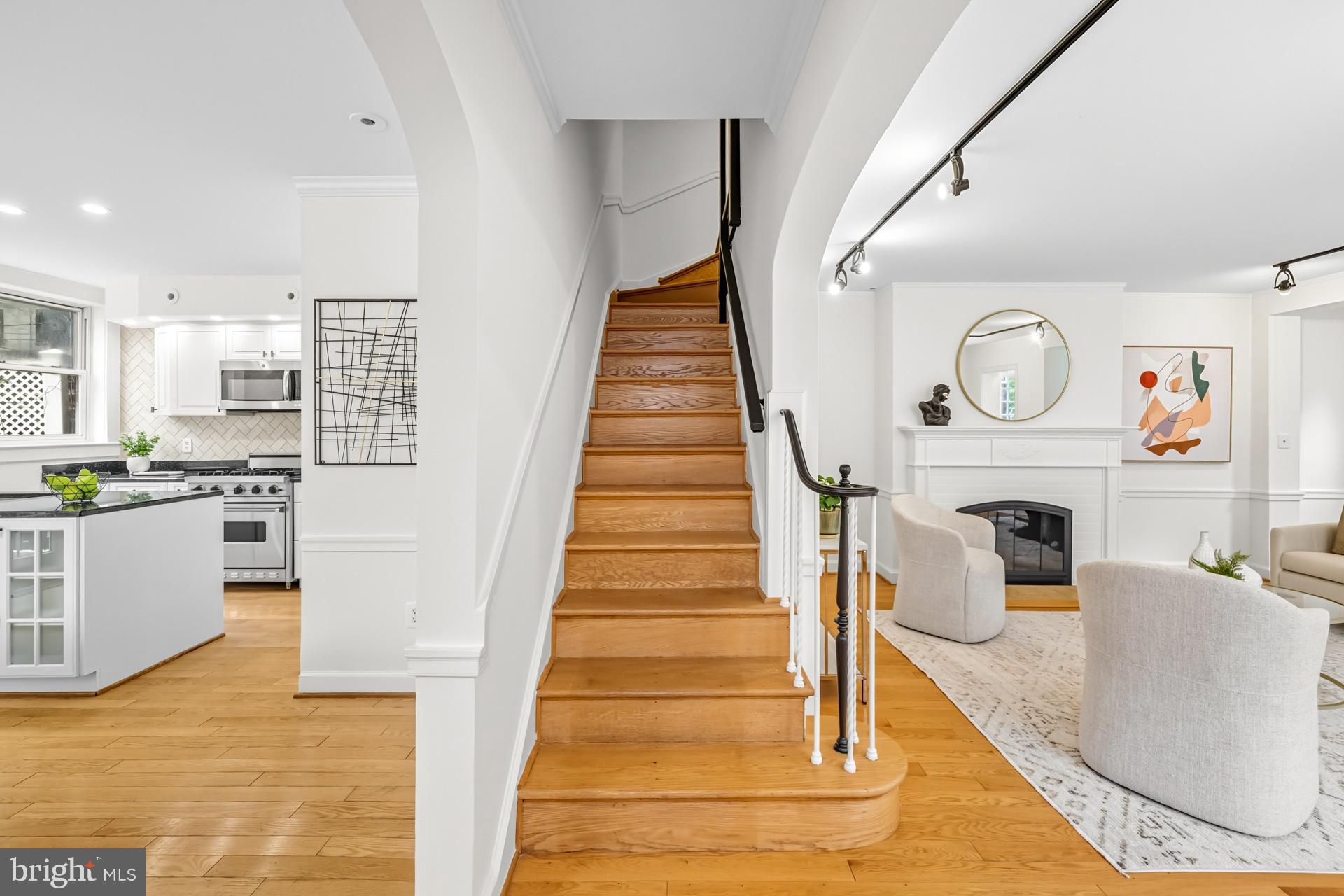 1628 44th Street Northwest Washington, DC 20007 - Photo 14 of 40 a living room with furniture and a fireplace