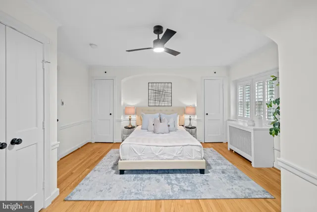 a room with a bed and window