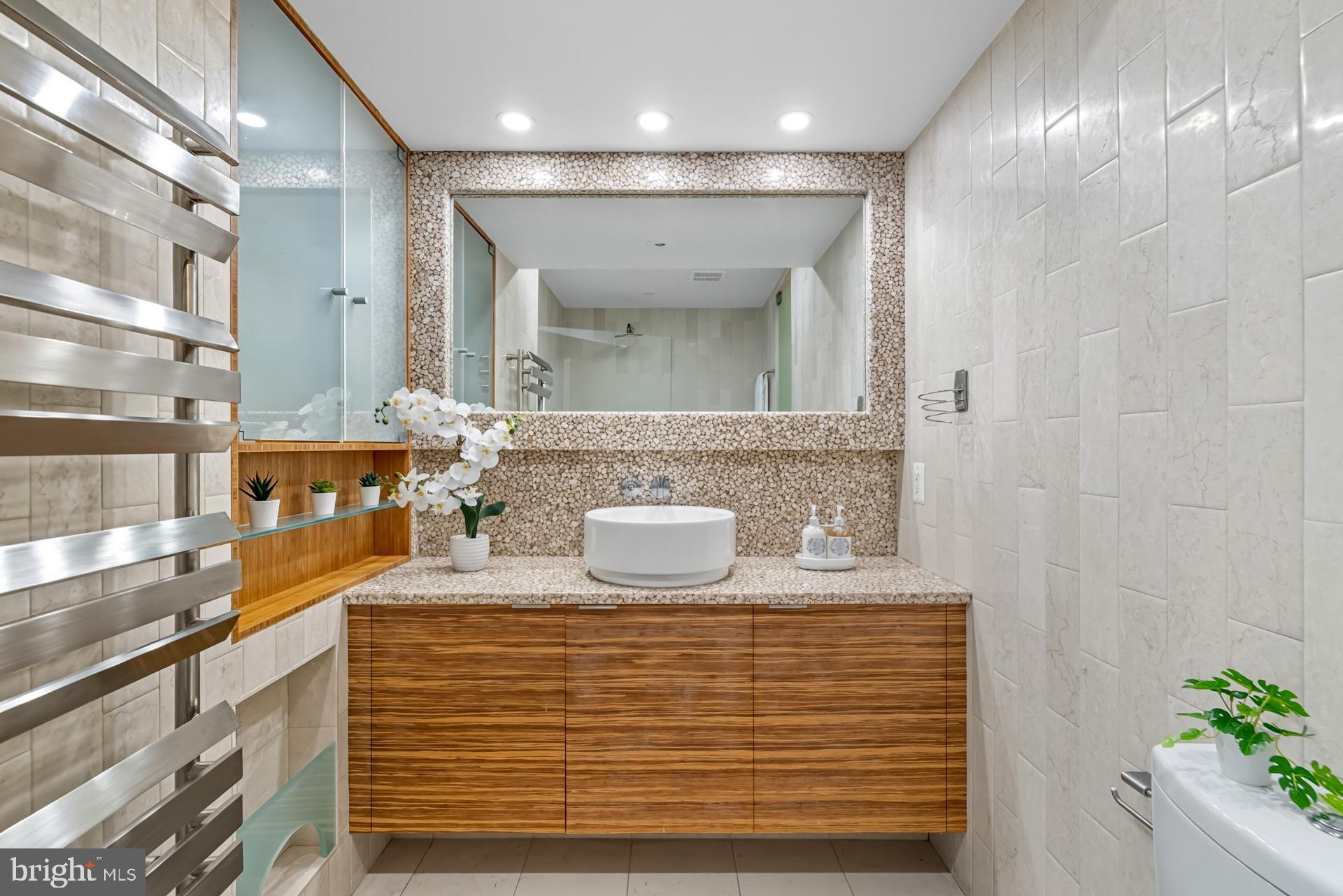 1628 44th Street Northwest Washington, DC 20007 - Photo 19 of 40 a bathroom with a sink and a mirror